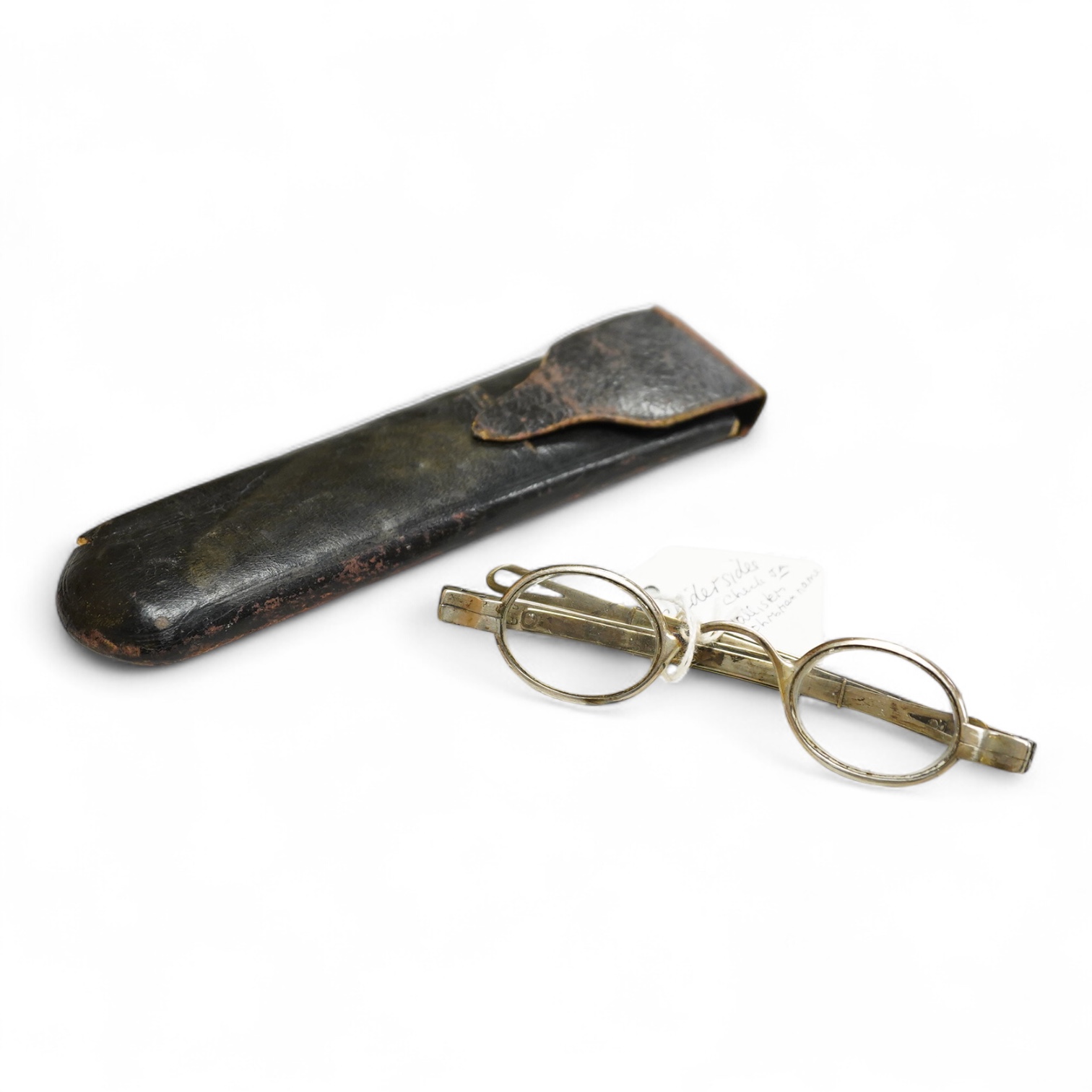 A pair of American ‘coin’ silver spectacles, first half 19th century by McAllister, Philadelphia, with slider sides, stamped inside McALLISTER PHILAD- and to the exterior hinge ‘JA 13’, unmarked leather and card case
